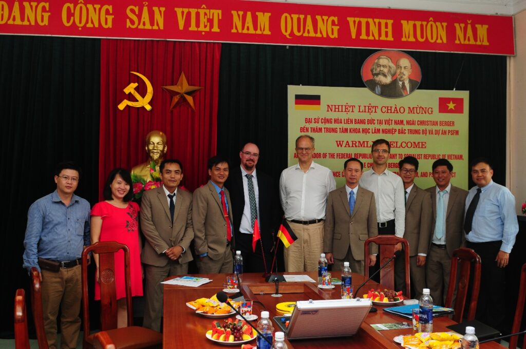 A group of people posing for a photo Description automatically generated